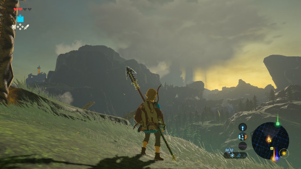 A screenshot of Breath of the Wild, with Link looking over a distant mountain vista. Large rainclouds can be seen looming in the sky.