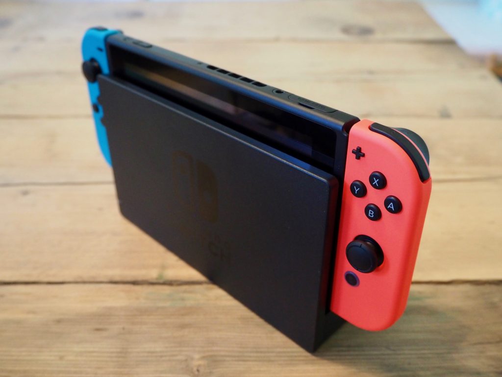 A Nintendo Switch console inserted into the TV dock accessory